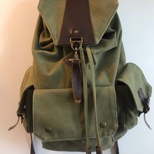 Green canvas rucksack backpack with PU leather details